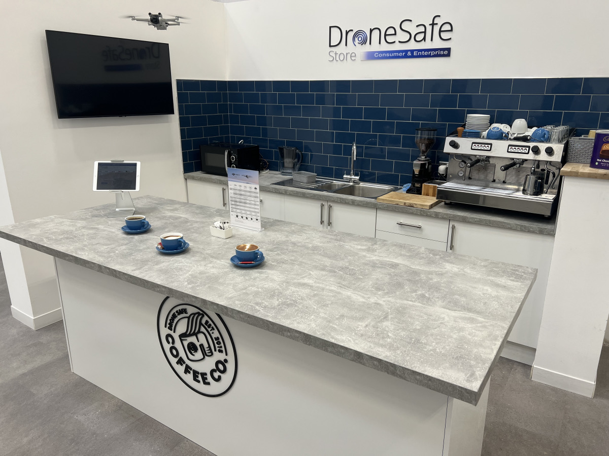 The café bar at Crawler World with espresso machine and fresh coffees on the counter